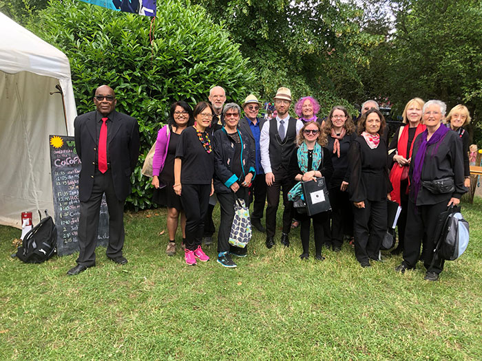Choir outside tent at CoCoMad festival Stirchley