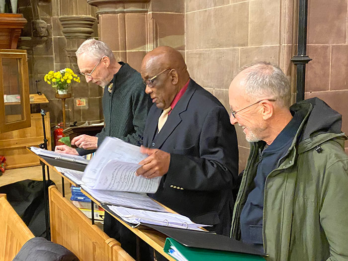 three tenors reading music